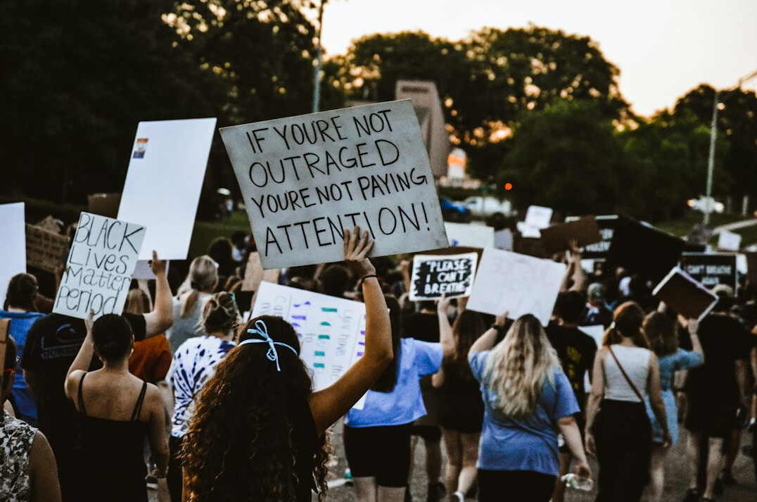 people protesting in street