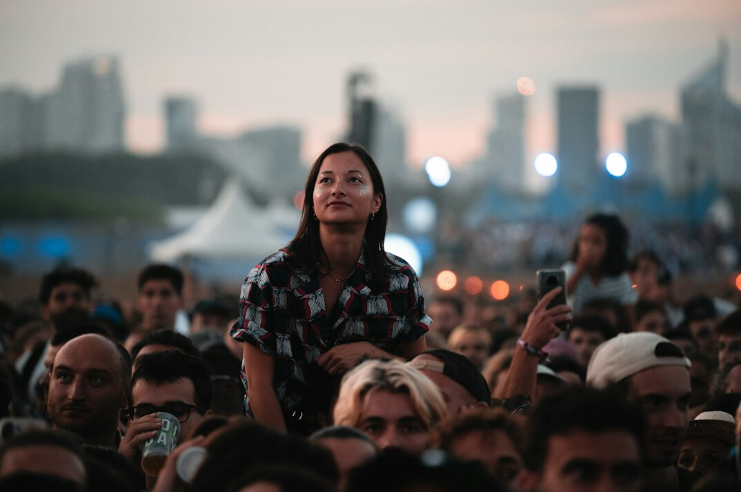 person standing alone in crowd
